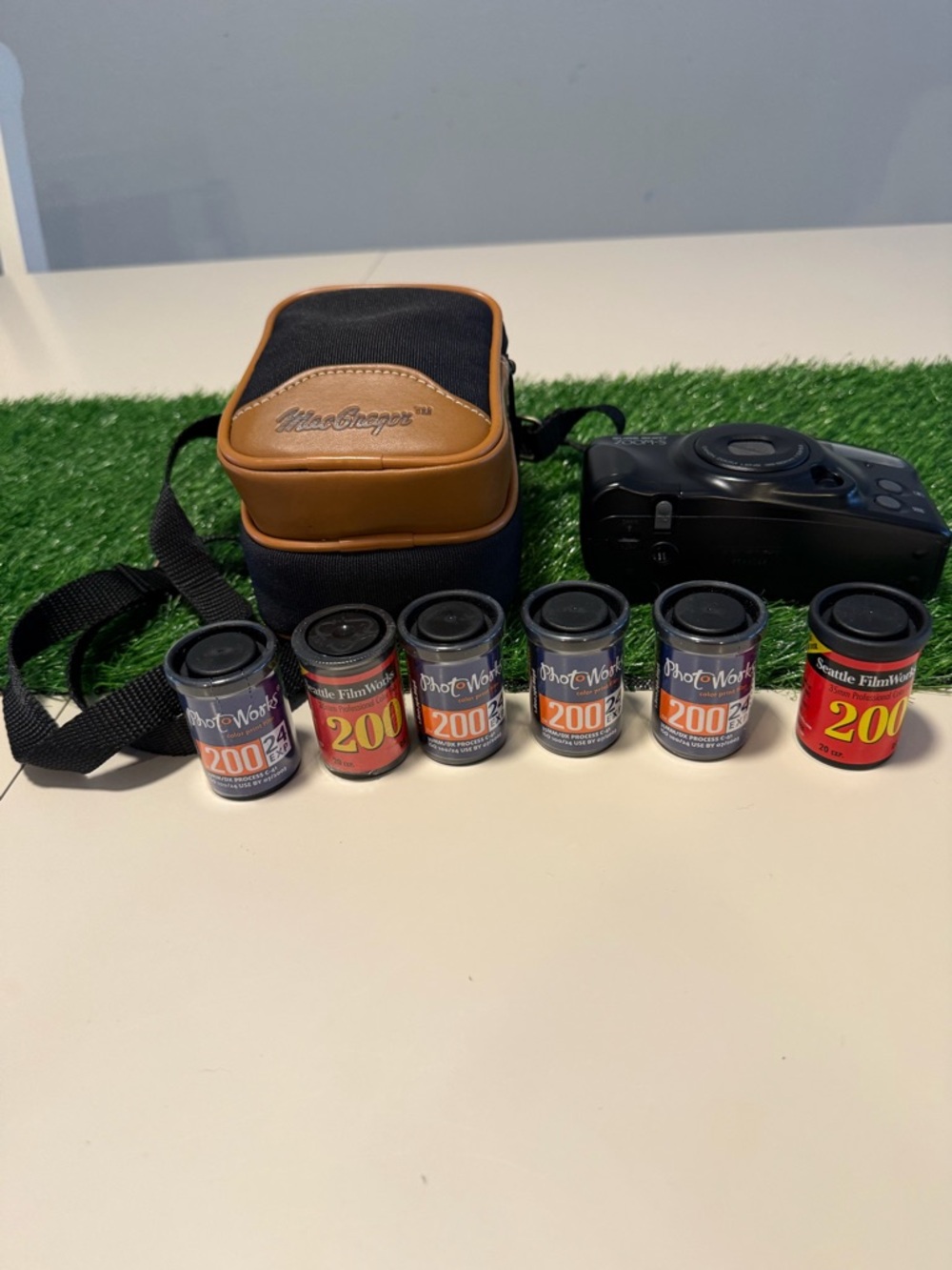 Cannon camera vintage and Brown/Black Camera Case with 35mm Film Canisters